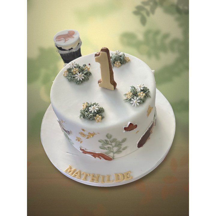 Close-up of a Wooly personalised cake – butterfly and squirrel cut from the edible sheet